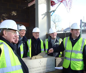 The picture shows Canon Seamus Cunningham (left) and parish priest Jeff Dodds (holding trowel).